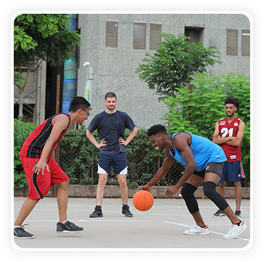 Students playing cricket, basketball, or using a gym.marwadi university,rajkot